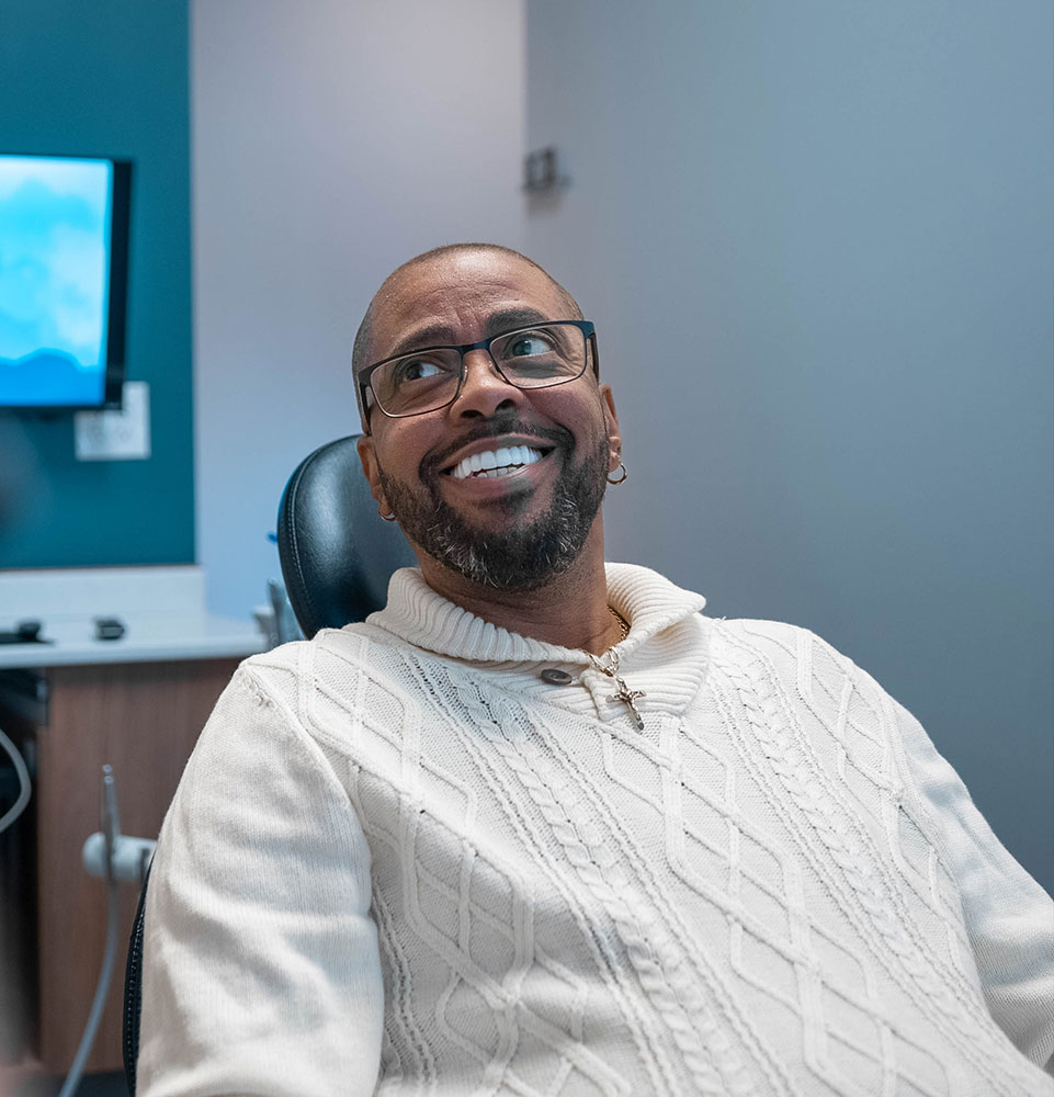 Happy Highland Implant Patient smiling after receiving Zygomatic dental implants